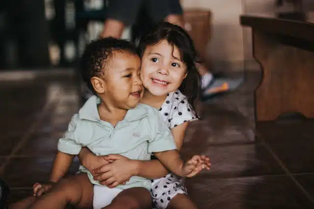 siblings hugging- for the post, managing sibling rivalry